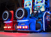 UNIS | BigFoot Crush | 2 - Player | Dual 32 - inch HD Screens | Steering Wheels | Racing Arcade Game